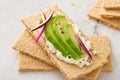 Close-up crispbread with avocado and cream cheese Royalty Free Stock Photo