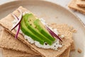 Close-up of crispbread with avocado in a plate Royalty Free Stock Photo