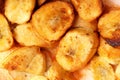 A close-up of crispy banana fritters, coated in golden batter and cut into bite-sized pieces. Royalty Free Stock Photo