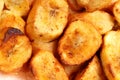 A close-up of crispy banana fritters, coated in golden batter and cut into bite-sized pieces. Royalty Free Stock Photo