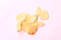 Crispy salt potato chips on white background