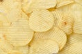 Crispy salt potato chips on white background