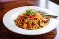 close-up of crispy tofu mixed with stir-fry sauce