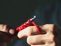 Close-up crocheting with red wool yarn on a dark background Royalty Free Stock Photo