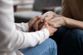 Close up of mature mom and adult daughter holding hands Royalty Free Stock Photo