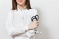 Close up cropped doctor woman with stethoscope isolated on white background. Female doctor in medical gown holds hands folded. Royalty Free Stock Photo