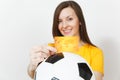 Beautiful European young people, football fan or player on white background. Sport, play, health, healthy lifestyle concept.