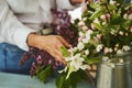 Mature woman making bouquet of garden flowers