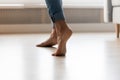 Close up cropped image of barefoot woman standing on tiptoes. Royalty Free Stock Photo