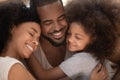 Close up happy african american family embracing. Royalty Free Stock Photo