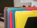 Close-up cropped image of pen and files with keyboard and spectacles on wooden office desk. Royalty Free Stock Photo