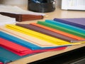 Close-up cropped image of pen and files with keyboard and spectacles on wooden office desk. Royalty Free Stock Photo