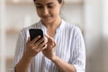 Close up cropped of Indian woman using phone, typing message