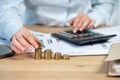 Close up cropped investor or sale manager lady in her formal wear shirt she put money in pile sit behind table in bright loft int