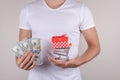 Close up cropped photo portrait of happy excited satisfied customer holding small pushcart with present inside and pile stack Royalty Free Stock Photo