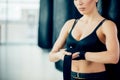 Close up cropped photo of slim woman with boxing bandages on her hands