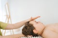 Close-up cropped shot of unrecognizable professional female physiotherapist doing neck adjustment to five year old boy Royalty Free Stock Photo