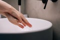 Close-up cropped shot of unrecognizable woman washing dirty hands rubbing using sanitizer soap, rinsing under warm
