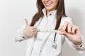 Close up cropped smiling doctor woman in medical gown with stethoscope, glasses showing thumbs up. Focus on clinical Royalty Free Stock Photo