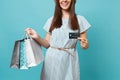 Close up cropped smiling pretty caucasian woman in summer dress holding packages bags with purchases after shopping Royalty Free Stock Photo