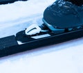 Close up of cross-county skiing boot locking onto skis