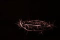 Close up of crown of thorns of Jesus on black background