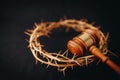 Close up of crown of thorns of Jesus and Judge gavel on black background