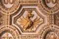 Close-up on crowned dragon symbol carved on marble wall