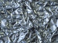 Close up crumpled aluminium tinfoil silver background