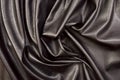 Close up on crumpled black leather material textured fabric. Royalty Free Stock Photo