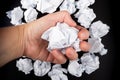 Close-up of crumpled paper in hand of businessman