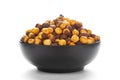 Close-Up of Crunchy Roasted Chana Masala in black Ceramic bowl, made with Bengal Grams or Chickpeas. Indian spicy snacks Namkeen