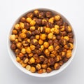 Close-Up of Crunchy Roasted Chana Masala in white Ceramic bowl, made with Bengal Grams or Chickpeas. Indian spicy snacks Namkeen