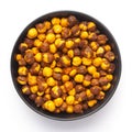 Close-Up of Crunchy Roasted Chana Masala in white Ceramic bowl, made with Bengal Grams or Chickpeas. Indian spicy snacks Namkeen