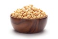 Close up of crunchy roasted Peanuts Indian namkeen snacks In hand-made handcrafted wooden bowl. Top view Royalty Free Stock Photo