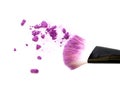 Close up of crushed blush on white background and cosmetic brush. Royalty Free Stock Photo