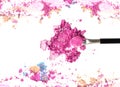 Close up of crushed blush on white background and cosmetic brush. Royalty Free Stock Photo