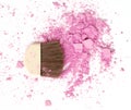 Close up of crushed blush on white background and cosmetic brush. Royalty Free Stock Photo