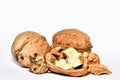 Close-up of crushed walnuts with nutshell isolated on white background Royalty Free Stock Photo