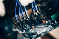 Cryptocurrency mining rig, details of computer motherboard and cables, graphics card and processor