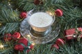 Egg nog in garland with lights and ornaments