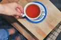 close up of cup of tea with blue stripes at home ,teatime and relax