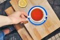 close up of cup of tea with blue stripes at home ,teatime and relax