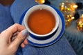 close up of cup of tea with blue stripes at home ,teatime and relax