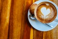 Close up cup of cappuccino in a white cup on a saucer with cookies. Top view copy place Royalty Free Stock Photo
