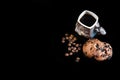Close-up cup of espresso coffee, round crunchy chocolate cookies with coffee beans on a black background, macro, empty space for t
