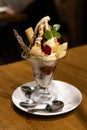 Close-up of a cup of fruit ice cream parfait on the table Royalty Free Stock Photo