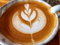 Close-up a cup of hot latte art simple tulip coffee Royalty Free Stock Photo