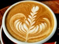 Close-up a cup of hot latte art simple tulip coffee Royalty Free Stock Photo