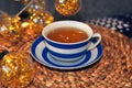 close up of cup of tea with blue stripes at home ,teatime and relax